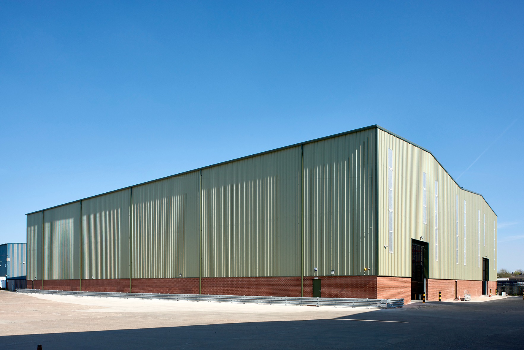 External view showing the double-bay warehouse form